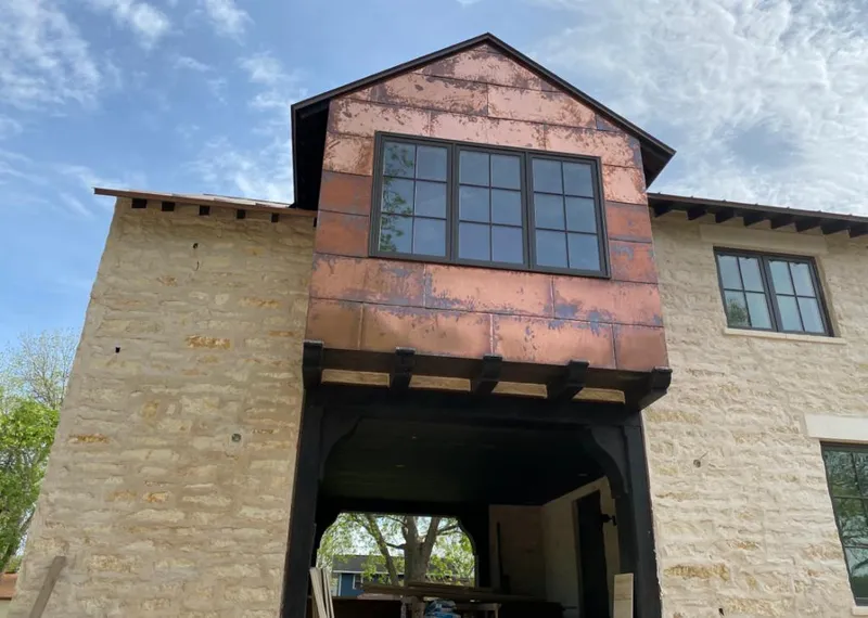 Copper metal panel facade on a stone building for Skylight Installation in Elizabethtown